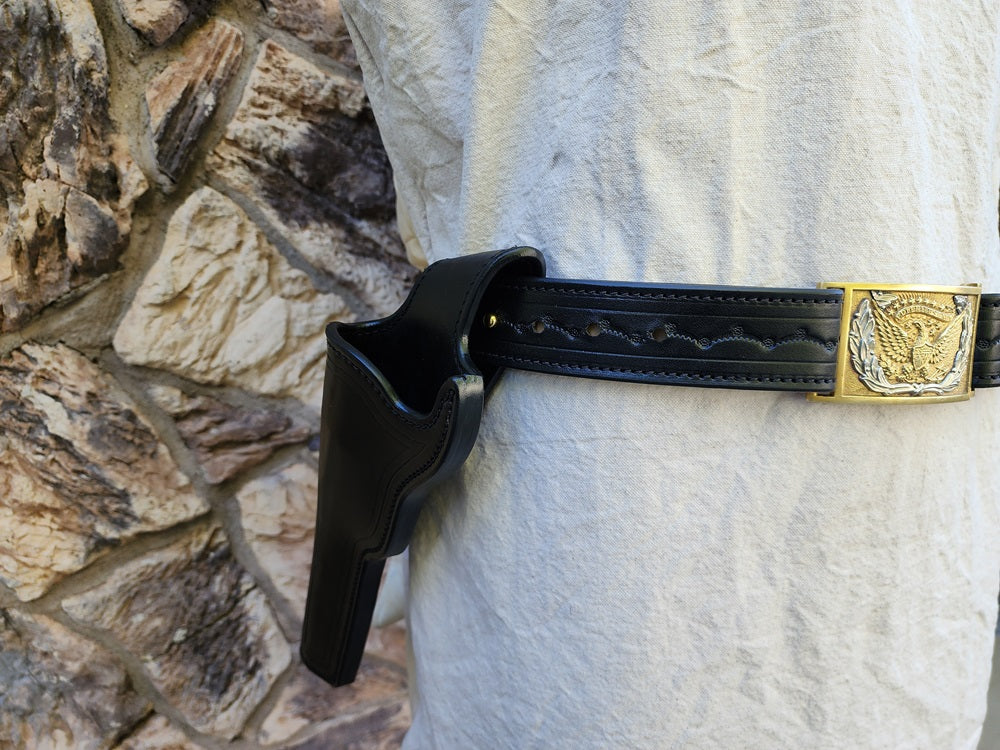 Close up view of the holster and buckle on our replica of Wild Bill Hickok's gun rig. The holster is styled and tooled to match the belt, the buckle is a gold and silver classic cavalry buckle.