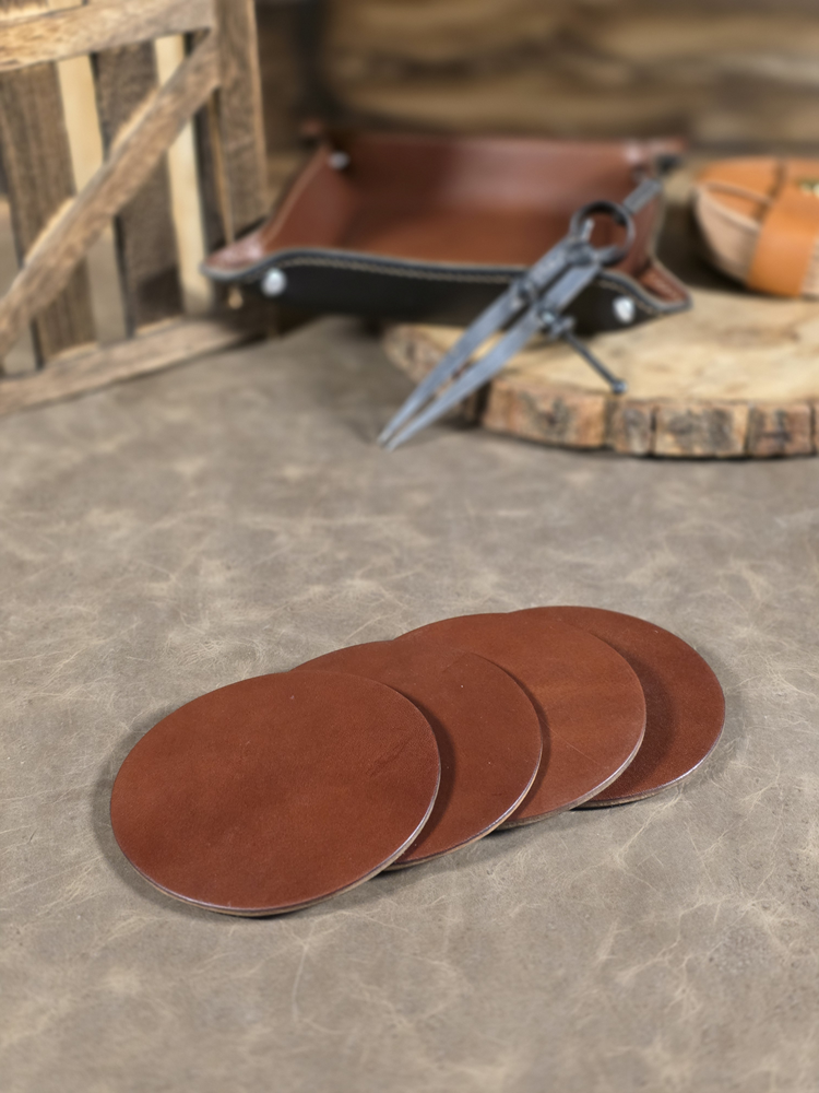 Set of brown leather coasters on a stone surface with rustic background