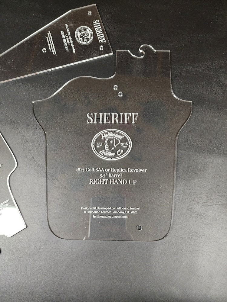 Main body of the three piece sherrif acrylic pattern sitting on a black leather background.