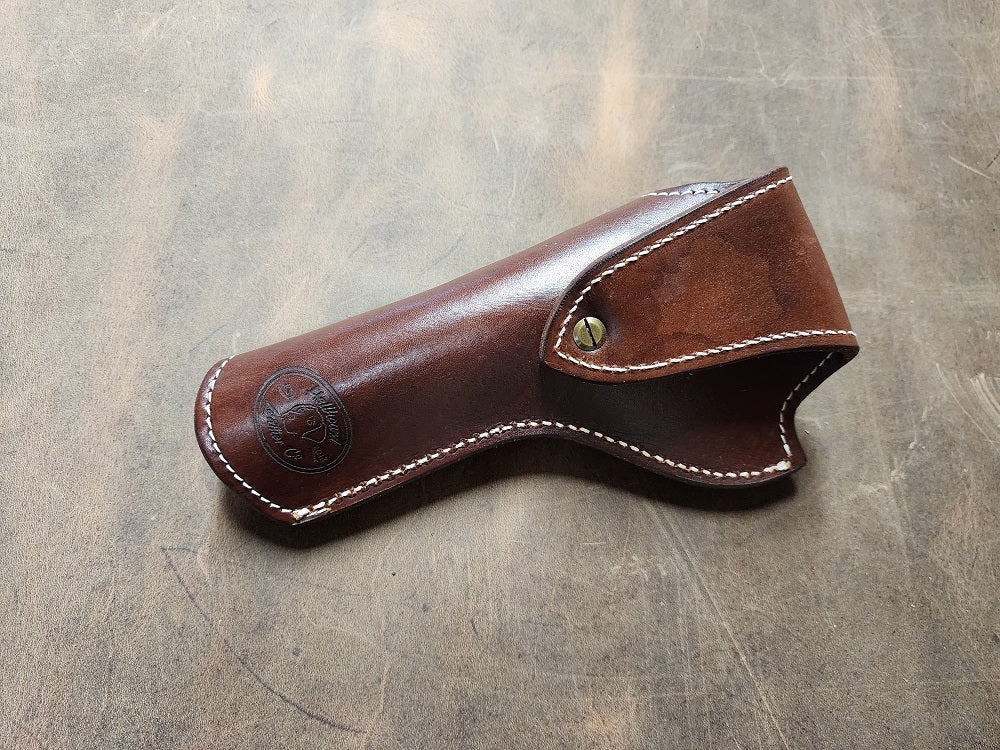 Back end of the Josh Faraday holster with solid brass hardware and white stitching, on the bottom of the holster is the hellhound leather co brand.