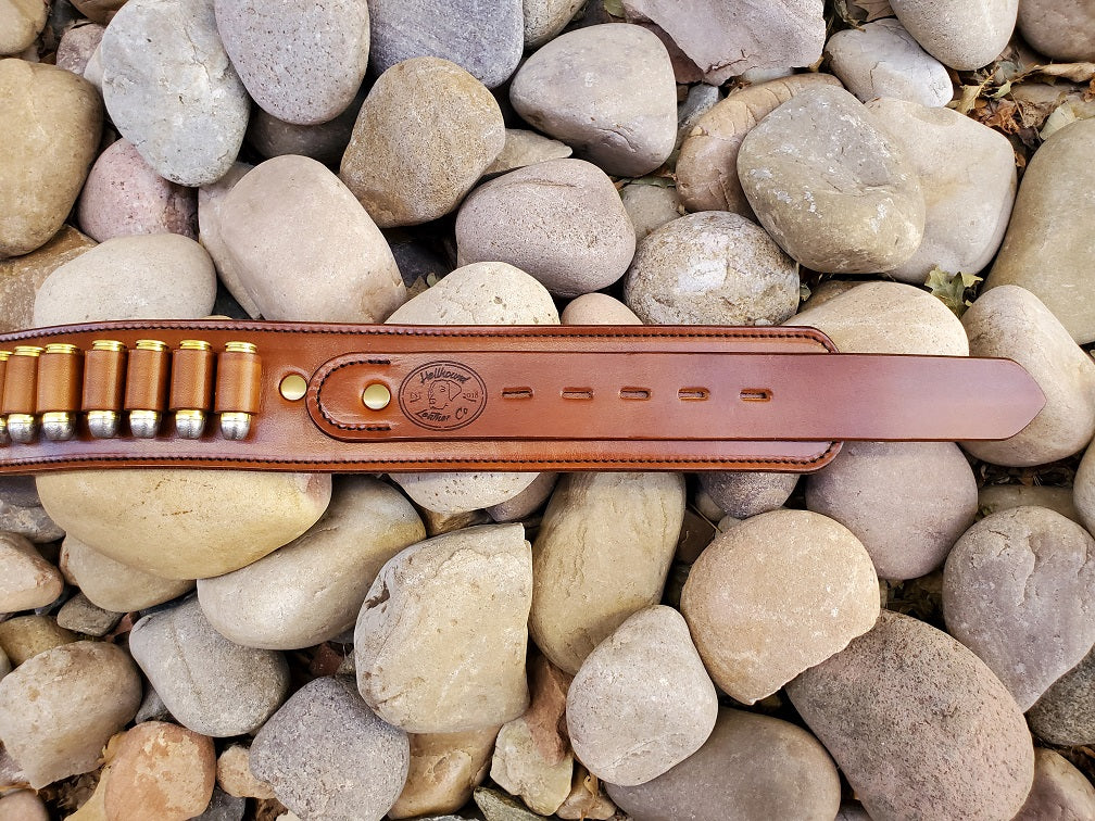 View of the belt focusing on the billet end of the belt. the belt is finished with solid brass hardware.