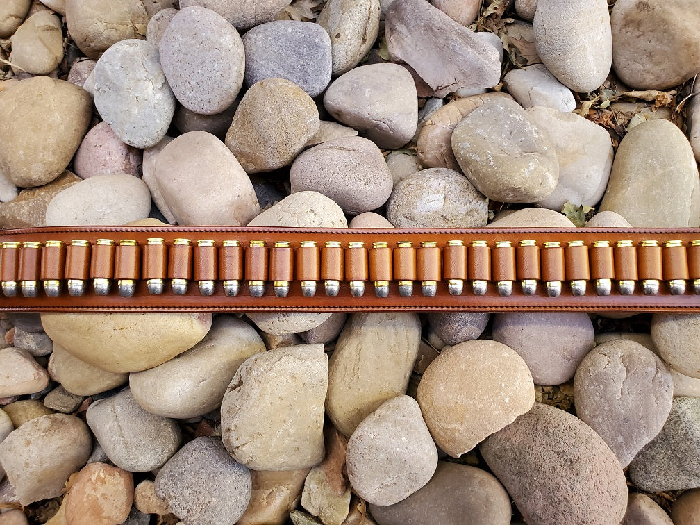 View focusing on the bullet loops in the brown leather gunfighter belt.