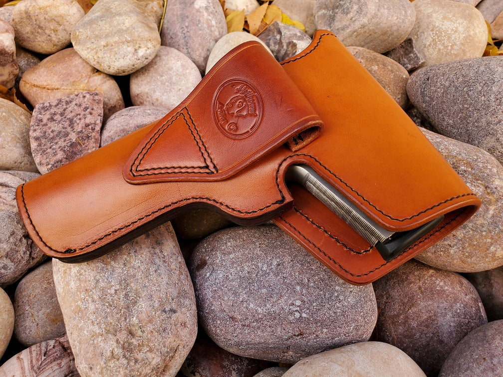 Rear view of the vintage 1911 russet leather holster with full flap coverage, the Hellhound Leather Co logo is stamped into the belt connection piece.