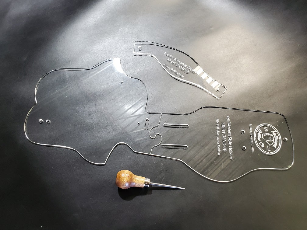 Clear high quality cast acrylic holster template used in leathercraft is sitting against a gray background. Next to it sits common leathercraft tools. 