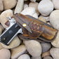 Handcrafted western holster for 1911 in rustic distressed brown leather and criss cross lacing