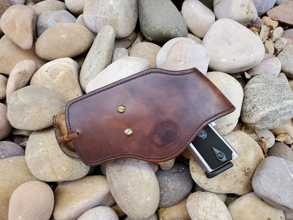 View of the 1911 ghostwood holster from the back end done with solid brass hardware.